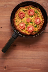 scrambled eggs on a wooden table
