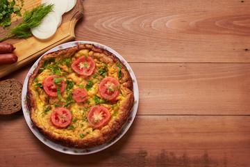 bread, sausage, scrambled eggs, bacon on a table