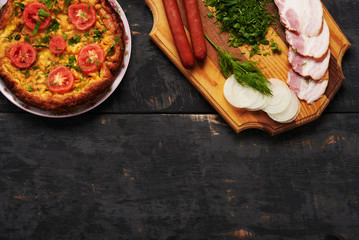 bread, sausage, scrambled eggs, bacon on a table
