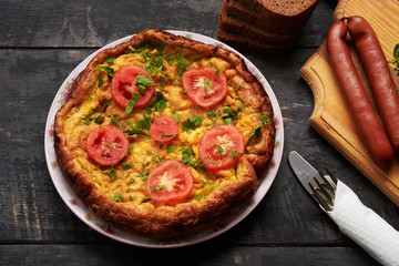 bread, sausage, scrambled eggs, bacon on a table