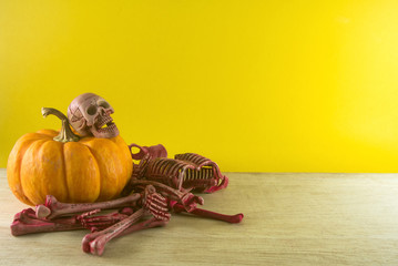 skull on pumpkin and bone of dead body