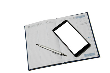 Smartphone and pen lying on the diary