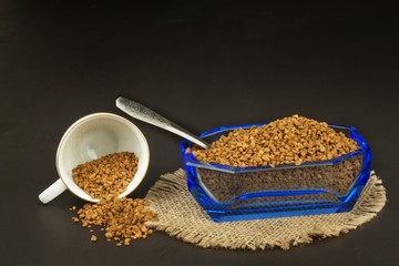 Instant coffee in a glass dish. Preparation of soluble coffee. Decorate store coffee.
