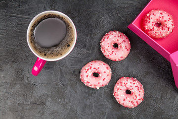 Tasty donuts on dark background