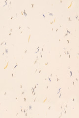 Speckled organic confetti paper background.