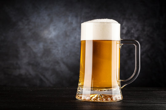 Beer mug on black background