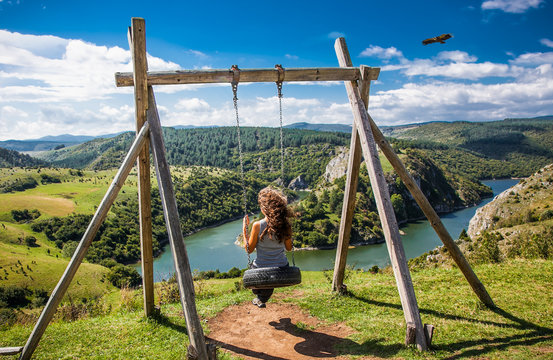 Beautiful woman on Meanders at rocky river Uvac,  Serbia.