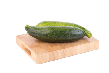 green zucchini vegetables isolated on white