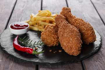 Breaded crispy chicken leg fried french fries sauce