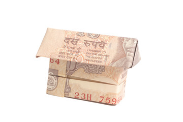 Origami Made of Indian rupee banknotes isolated on white backgro