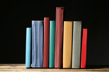 Old antique books on brown wooden table