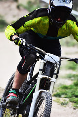 Sport race Mountain biker extreme and fun downhill track. Dirt splash.