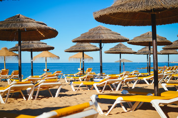 Beach ready for tourists. Golden sand with blue sky outdoors nature background