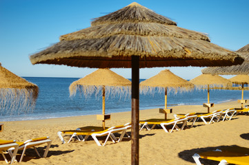Beach ready for tourists. Golden sand with blue sky outdoors nature background