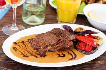 Juicy beef steak with French cream sauce 