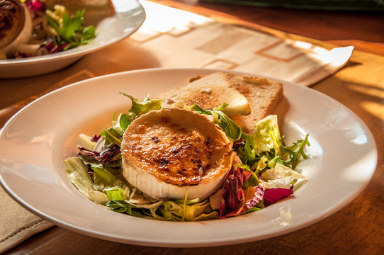 Czech Specialities: Grilled goat cheese with honey and chopped salad