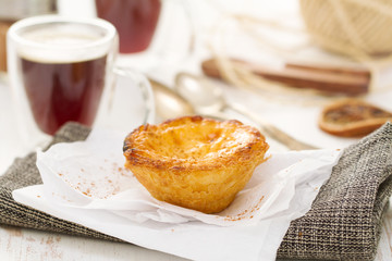 traditional portuguese dessert pastel de nata with cup of coffee