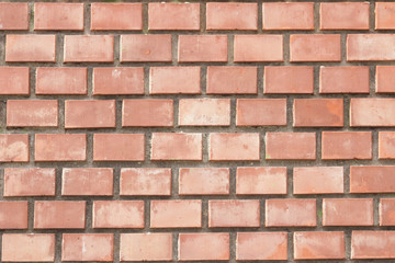 Old red brick wall background macro, selective focus.