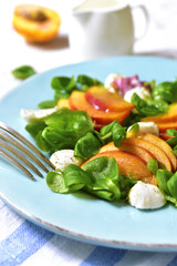 Fresh peach salad with corn and mozzarella.