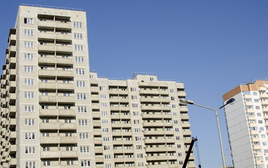 Monolithic concrete buildings against the sky.