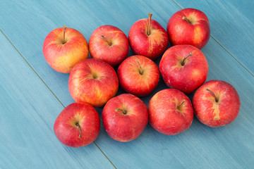 Red apples on a blue table