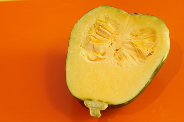 Yellow and ripe pumpkin lie on a bright background. 