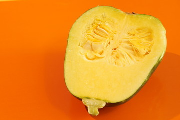 Yellow and ripe pumpkin lie on a bright background. 