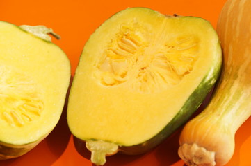 Yellow and ripe pumpkin lie on a bright background. 
