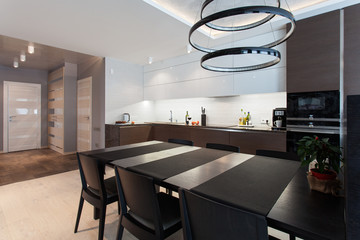Design interior of a high tech kitchen with a  black table and chairs