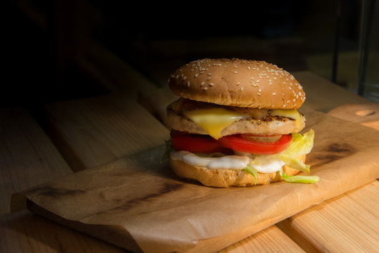 fast food on wooden table with contrast light