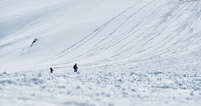 Man skier slides down the mountainside