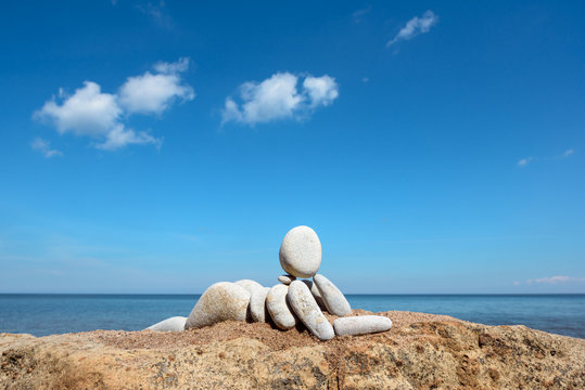 Figurine on the coast