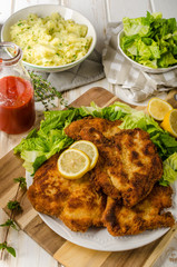 Delicious schnitzel with salad