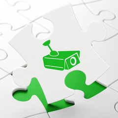 Privacy concept: Cctv Camera on puzzle background