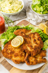 Delicious schnitzel with salad