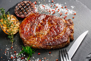 Beef rump steak from marble beef medium rare with grilled lemon