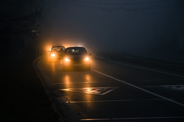 Fototapeta na wymiar car driving in foggy weather