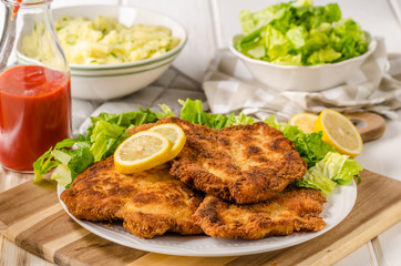 Delicious schnitzel with salad