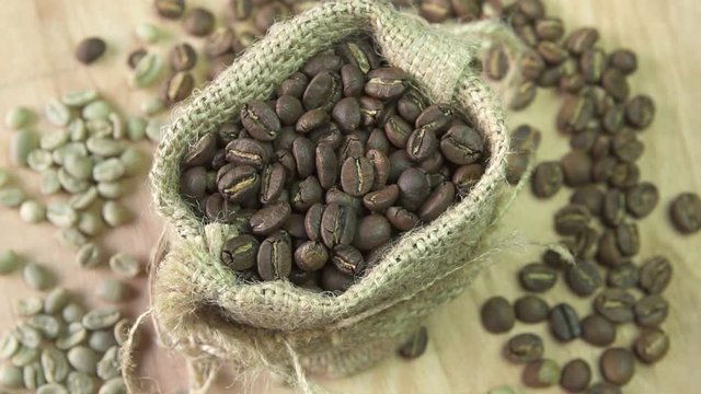 Coffee beans rotating in burlap, close up