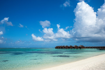 Beautiful beach with water bungalows at Maldives