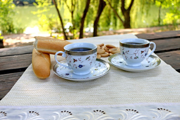 ruddy loaf on the table and close bagels and cup of coffee