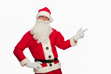 Santa Claus pointing sign with smile, isolated on white backgrou