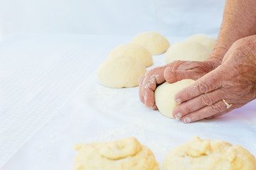 Making dough by grandma's hands.