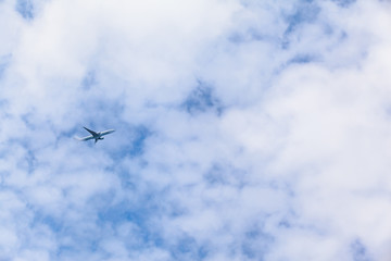 Plane Flying High / Airplane climb up through clouds into the sky after departure (copy space)