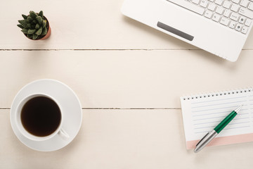 Office table with cup of coffee 