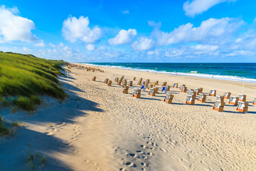 Chairs on sandy beach in Wenningsted town, Sylt island, Germany