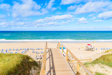 Wooden footbridge to beach in Westerland village on Sylt island, Germany