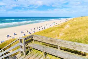 Wooden walkway on sand dune leading to beach in List village, Sylt island, Germany
