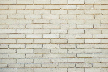 Old beige brick wall background texture