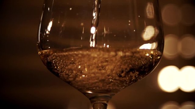 Pouring white wine in slow motion